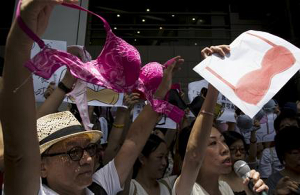 Protesters hold up bras during a demonstration in support of Hong Kong female protester Ng Lai-ying, outside the police headquarters in Hong Kong, on Sunday. Photo: Reuters