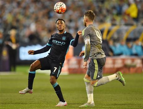Raheem Sterling, left, of Manchester City and Sergio Ramos of Real Madrid contest for the ball during their International Championship Cup soccer match in Melbourne, Australia, Friday, July 24, 2015. AP