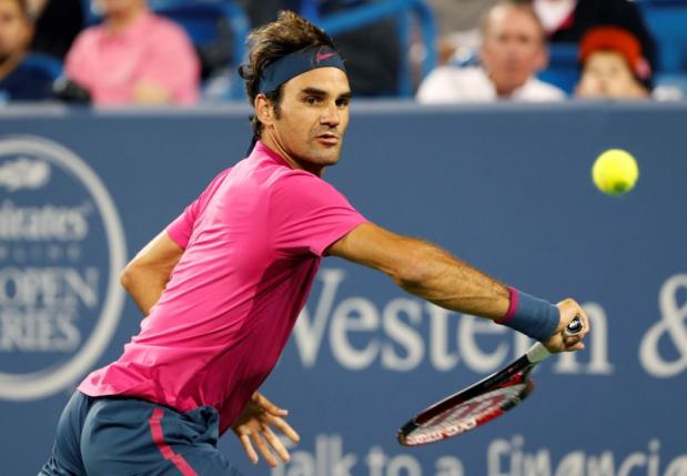 Aug 20, 2015; Cincinnati, OH, USA; Roger Federer (SUI) returns a shot against Kevin Anderson (not pictured) on day six during the Western and Southern Open tennis tournament at Linder Family Tennis Center. Mandatory Credit: Aaron Doster-USA TODAY Sports