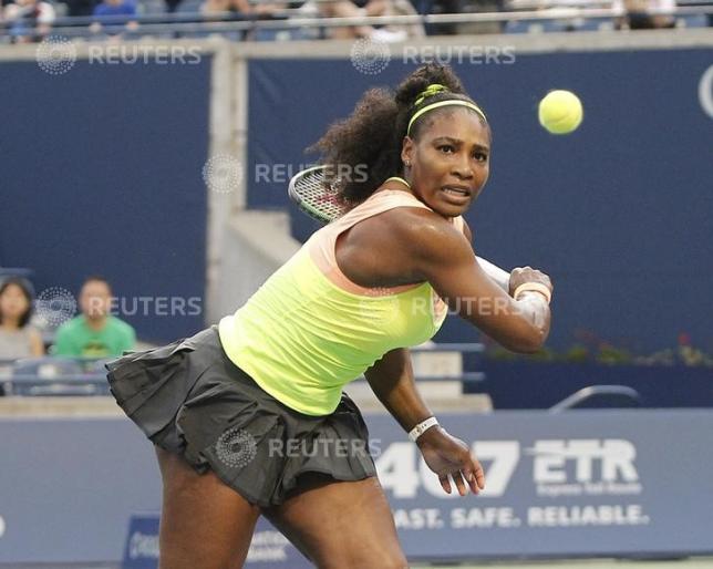 Aug 14, 2015; Toronto, Ontario, Canada; Serena Williams (USA) returns a ball against Roberta Vinci (not pictured) during the quarter finals of the Rogers Cup tennis tournament at Aviva Centre. Williams defeated Vinci.  Mandatory Credit: John E. Sokolowski-USA TODAY Sports