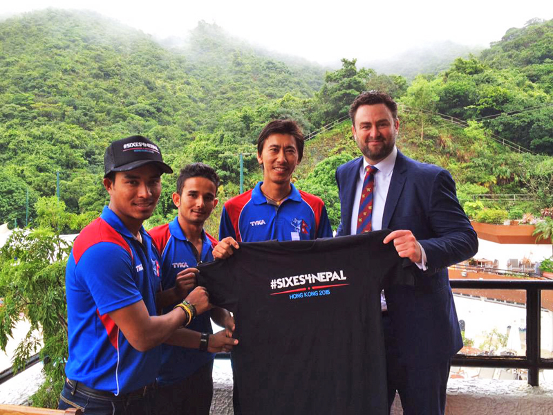 Hong Kong Cricket Association CEO Tim Cutler (right) handing over Sixes4Nepal jersey to Nepali players Shakti Gauchan, Bhuwan Karki and Sompal Kami before the charity tournament at Kowloon Cricket Club grounds on Sunday.  Photo:THT