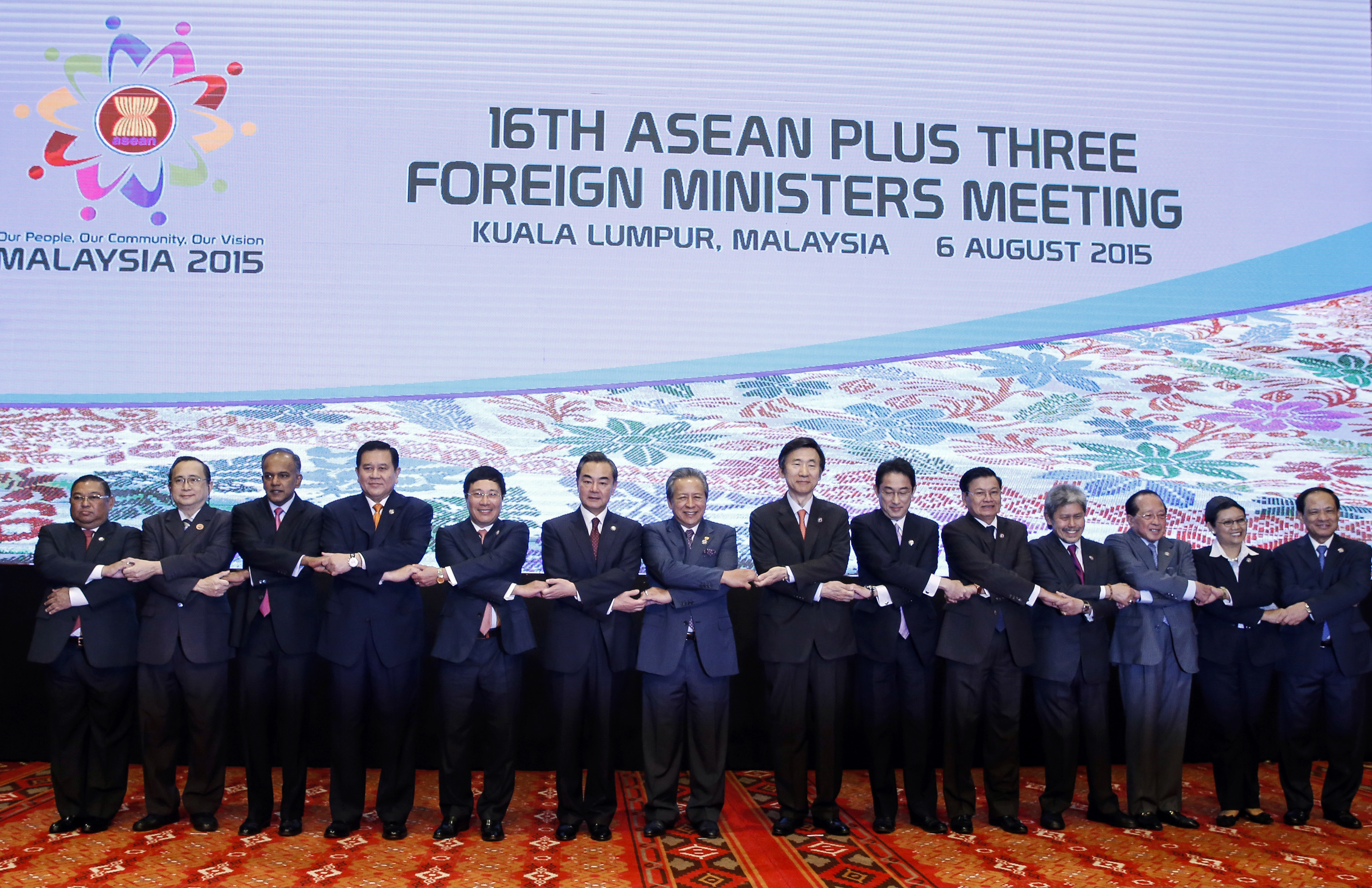 (left to right) In this August 6, 2015 file photo, Myanmar's Foreign Minister Wunna Maung Lwin, Philippines's representative Evan Garcia, Singapore's Foreign Minister K. Shanmugam, Thailand's Foreign Minister Tanasak Patimapragorn, Vietnam's Foreign Minister Pham Binh Minh, China's Foreign Minister Wang Yi, Malaysia's Foreign Minister Anifah Aman, Republic of Korea's Foreign Minister Yun Byung-se, Japan's Foreign Minister Fumio Kishida, Laos's Foreign Minister Thongloun Sisoulith, Brunei's Foreign Minister Mohamed Bolkiah, Cambodia's Foreign Minister Hor Namhong, Indonesia's Foreign Minister Retno Marsudi, and ASEAN's Secretary General Le Luong Minh pose for a group photo before ASEAN Plus Three Foreign Ministers' Meeting in Kuala Lumpur, Malaysia. The dispute over the strategic waterways of the South China Sea has intensified, pitting a rising China against its smaller and militarily weaker neighbors who all lay claim to a string of isles, coral reefs and lagoons mostly in the Spratly and the Paracel islands. Photo: AP 