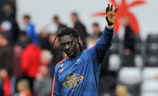 Swansea's Bafetimbi Gomis waves to fans after the game. Photo: Reuters