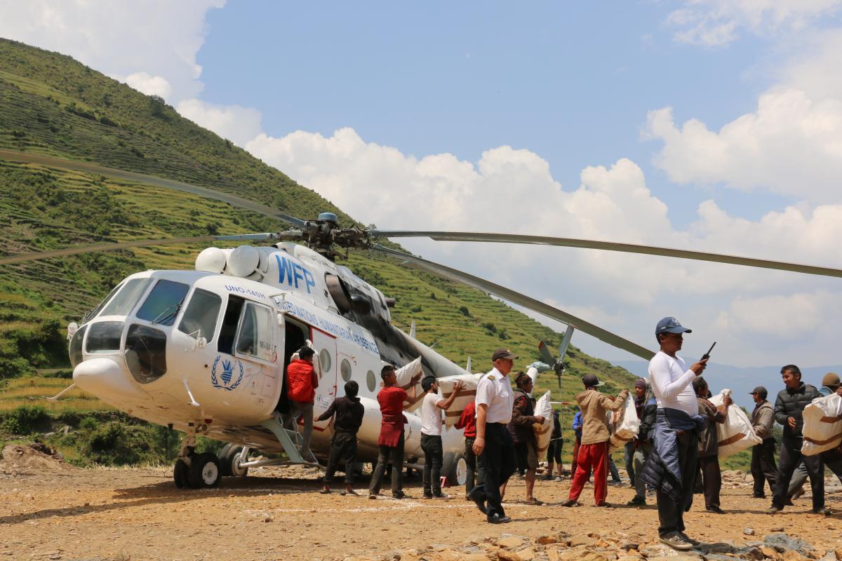 WFP helicopter ferrying relief materials in earthquake-hit region. Photo: Log Cluster