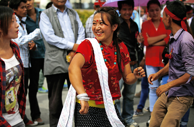 A participant of indigenous ethnic community performing a traditional dance during a protest in New Baneshwor, Kathmandu on Wednesday. Photo: Skanda Gautam/ THT