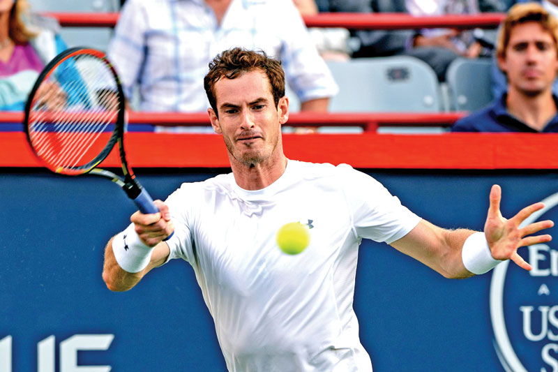 Andy Murray of Great Britain returning to Tommy Robredo of Spain on the third day of the Rogers Cup match at Uniprix Stadium in Montreal, on Wednesday. Photo: AFP