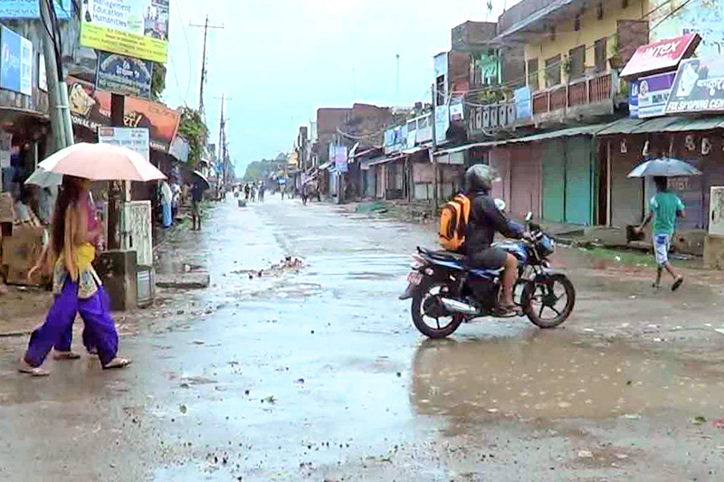 People walking on the barren streets after the Tharu Kalyankarini Sabha (Tharu Welfare Assembly) Struggle Committee announced an indefinite district-wide shut down in Bardiya District on Tuesday, August 11, 2015. Photo: RSS