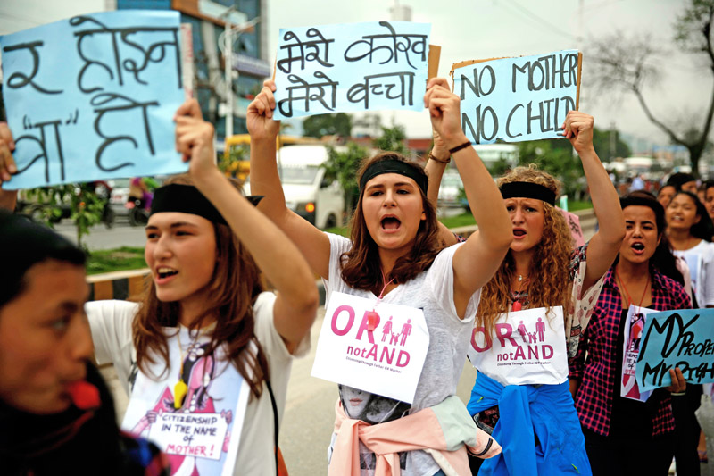 Women hold placards while shouting slogans during a protest rally demanding citizenship in the name of mother, in Kathmandu, on Tuesday. Photo: Skanda Gautam/ THT