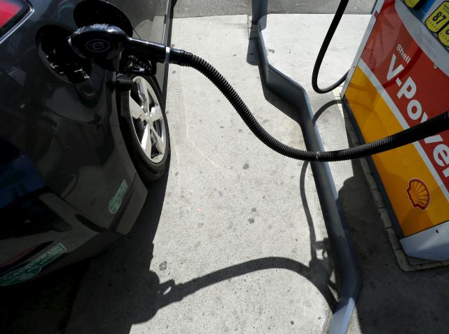A car is filled with gasoline at a gas station pump in Carlsbad, California August 4, 2015. REUTERS/Mike Blake