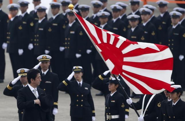 Japan's Prime Minister Shinzo Abe reviews members of Japan Self-Defense Force in Omitama, northeast of Tokyo. Photo: Reuters 