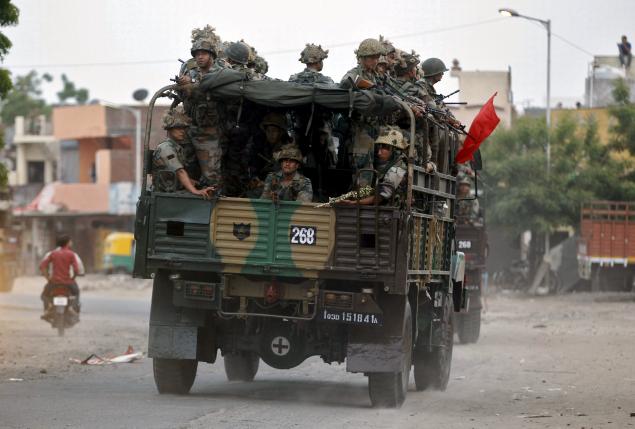 Army soldiers patrol after clashes between police and protesters in Ahmedabad, India, August 26, 2015. Photo: Reuters