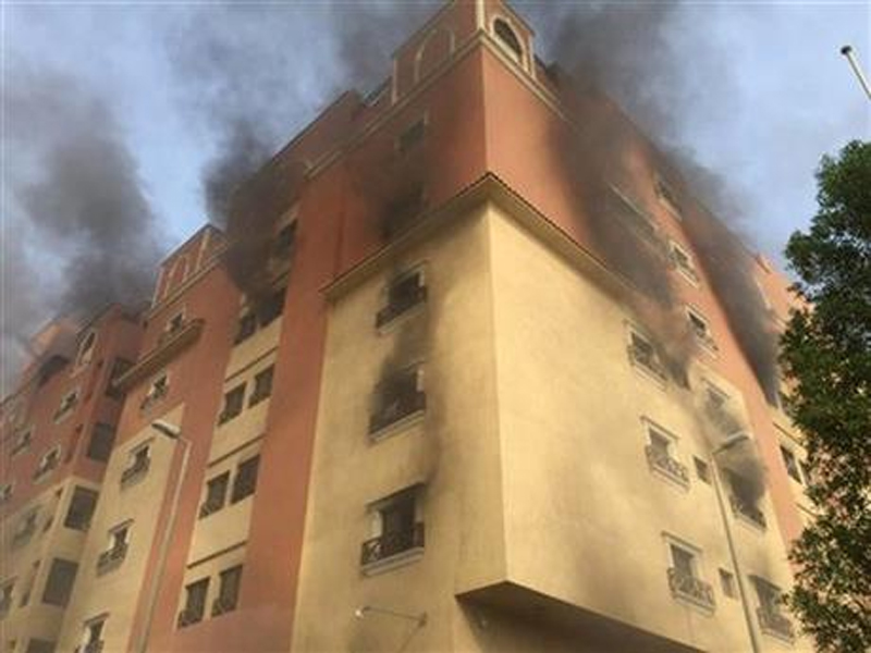 In this image released by the Saudi Interior Ministryu0092s General Directorate of Civil Defense, smoke billows from a fire at a residential complex used by state oil giant Saudi Aramco in Khobar, Saudi Arabia, Sunday, Aug. 30, 2015. Authorities say one person has been killed and dozens were injured in the fire. Photo: AP