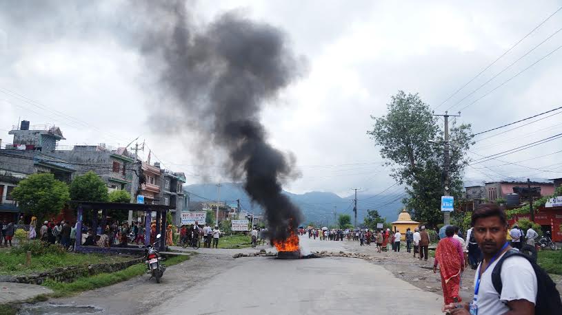 A tyre burnt by the anguished locals in protest against the murder of Ramji Paudel along the Pritivi Highway on Friday, August 14, 2015. Photo: Bharat Koirala