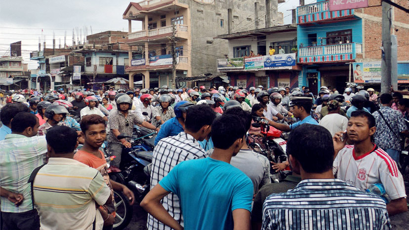 Motorcycle riders queuing up to fill their vehicles at a petrol pump in Gaighat, Udayapur, on Monday.Photo: THT