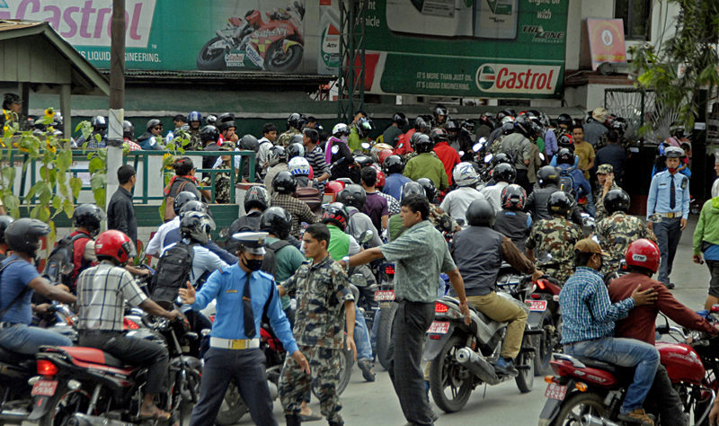 PANIC BUYING? Two-wheeler riders queuing up to fill petrol at a pump run by the Nepali Army in Bhadrakali, Kathmandu, on Wednesday. Photo: THT
