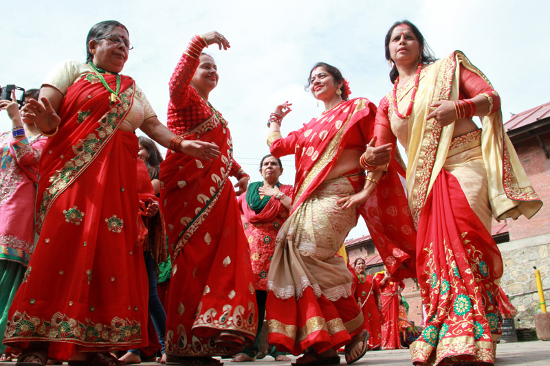 Fasting women dancing and singing while visiting Pashupatinath temple early in the morning on the occasion of Haritalika Teej  on Wednesday, September 16, 2015. Photo: RSS