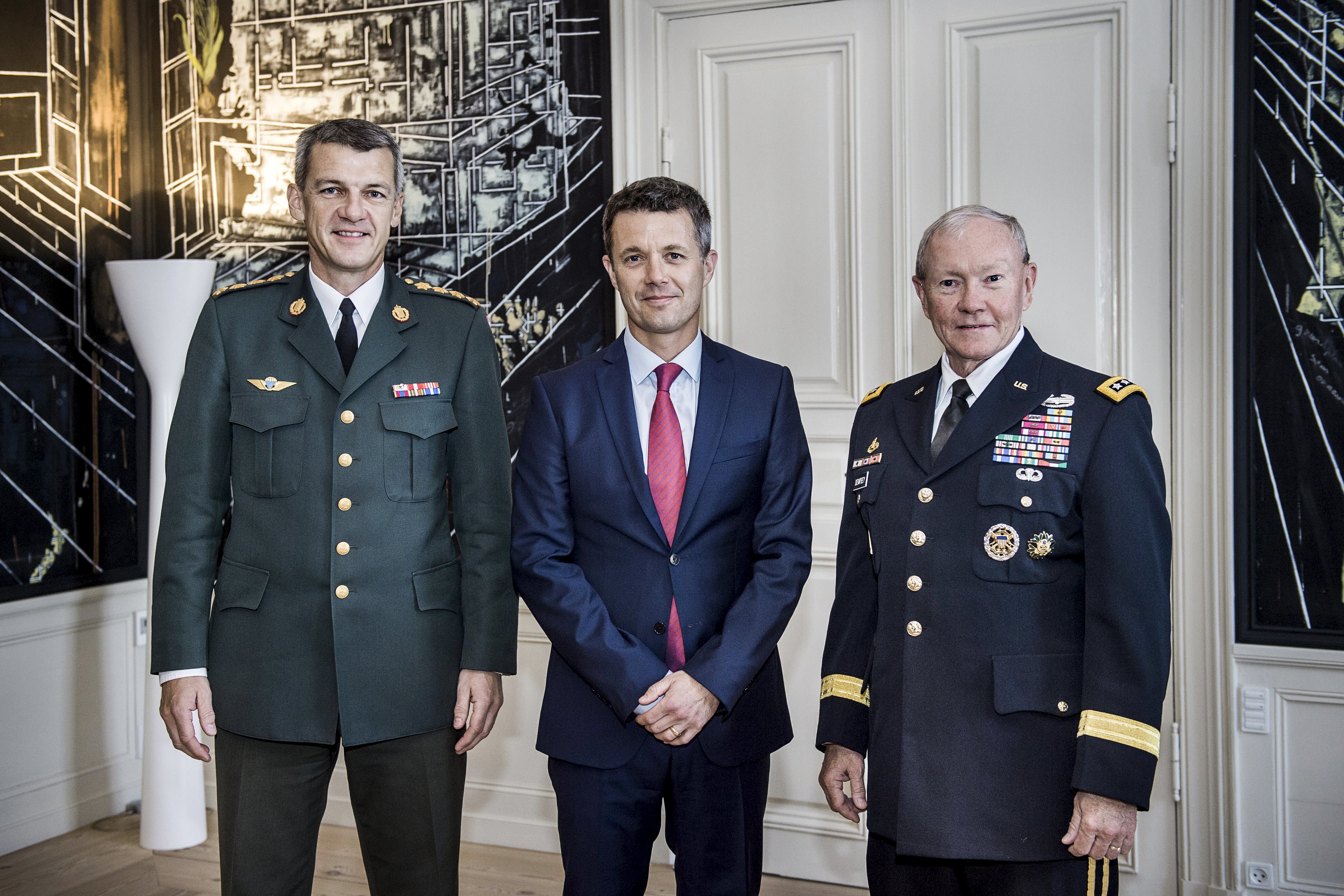 Crown Prince Frederik of Denmark meets Chairman of the Joint Chiefs of Staff, US Army General Martin Dempsey (right) and Danish Chief of Defence General Peter Bartram in the Crown Prince's meeting room at Amalienborg Castle, in Copenhagen August 18, 2015. Photo: Reuters