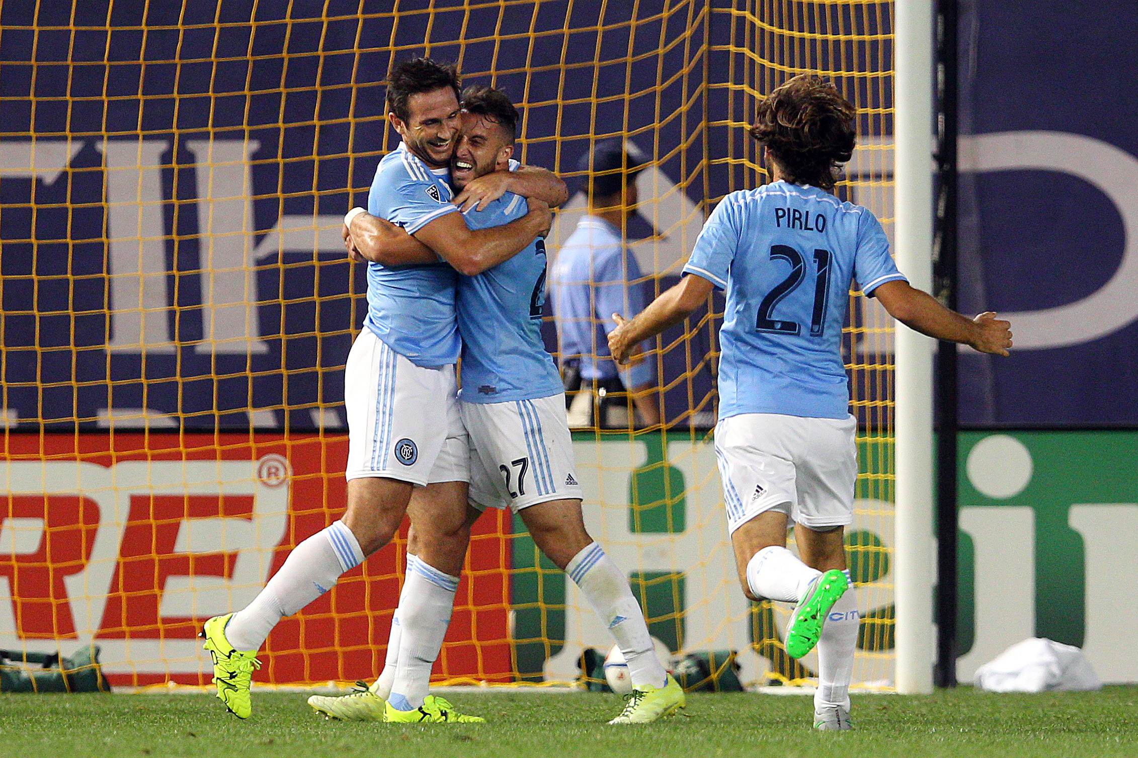 Sep 16, 2015; New York, NY, USA; New York City FC midfielder Frank Lampard (8) and New York City FC defender R.J. Allen (27) and New York City FC midfielder Andrea Pirlo (21) celebrate Lampard's goal against Toronto FC during the first half at Yankee Stadium. Mandatory Credit: Brad Penner-USA TODAY Sports