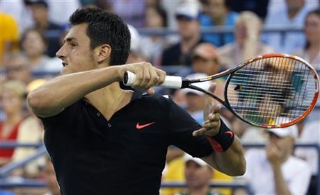 Bernard Tomic, of Australia follows through on a shot during his second round match against countryman Lleyton Hewitt at the US Open Tennis tournament in New York, Thursday, September 3, 2015. Photo: AP