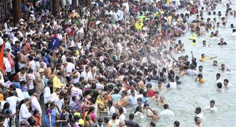 Hindu devotees gather for the third royal bath in the river Godavari during the ongoing Kumbh Mela, or Pitcher Festival, in Nashik, Maharashtra state, India, Friday, Sept. 18, 2015. Hindus believe taking a dip in the waters of a holy river during the festival will cleanse them of their sins. According to Hindu mythology, the Kumbh Mela celebrates the victory of gods over demons in a furious battle over a nectar that would give them immortality. Photo: AP