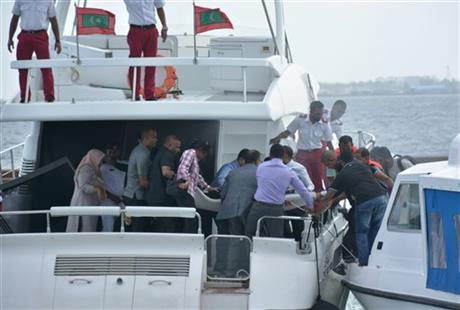 Unidentified injured people are evacuated after a blast on the Maldives President Yameen Abdul Gayoom speedboat in Male, Maldives Monday, Sept. 28, 2015. Gayoom's wife Fathimath Ibrahim and several officials suffered minor injuries. The country's international airport is on a separate island and a short boat trip is needed to reach the capital island. Photo: AFP