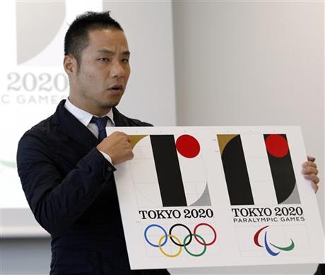 In this Aug. 5, 2015, file photo, Japanese designer Kenjiro Sano gives a detailed explanation of how he came up with his logo, left, for the 2020 Tokyo Olympics at a press conference in Tokyo. Tokyo Olympic organizers are expected to scrap the logo for the 2020 Games on Tuesday, Sept. 1, 2015 following another allegation its Japanese designer might have used copied materials in presentations of the design. Photo: AP