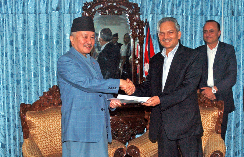 Constitutional Political Dialogue and Consensus Committee Chairman Baburam Bhattarai, who also heads the five-member panel formed for sequential arrangement of the draft constitution, submitting its report to Constituent Assembly Chairman Subas Chandra Nembang, in Kathmandu, on Thursday. Photo: Dhruba Ale/ THT