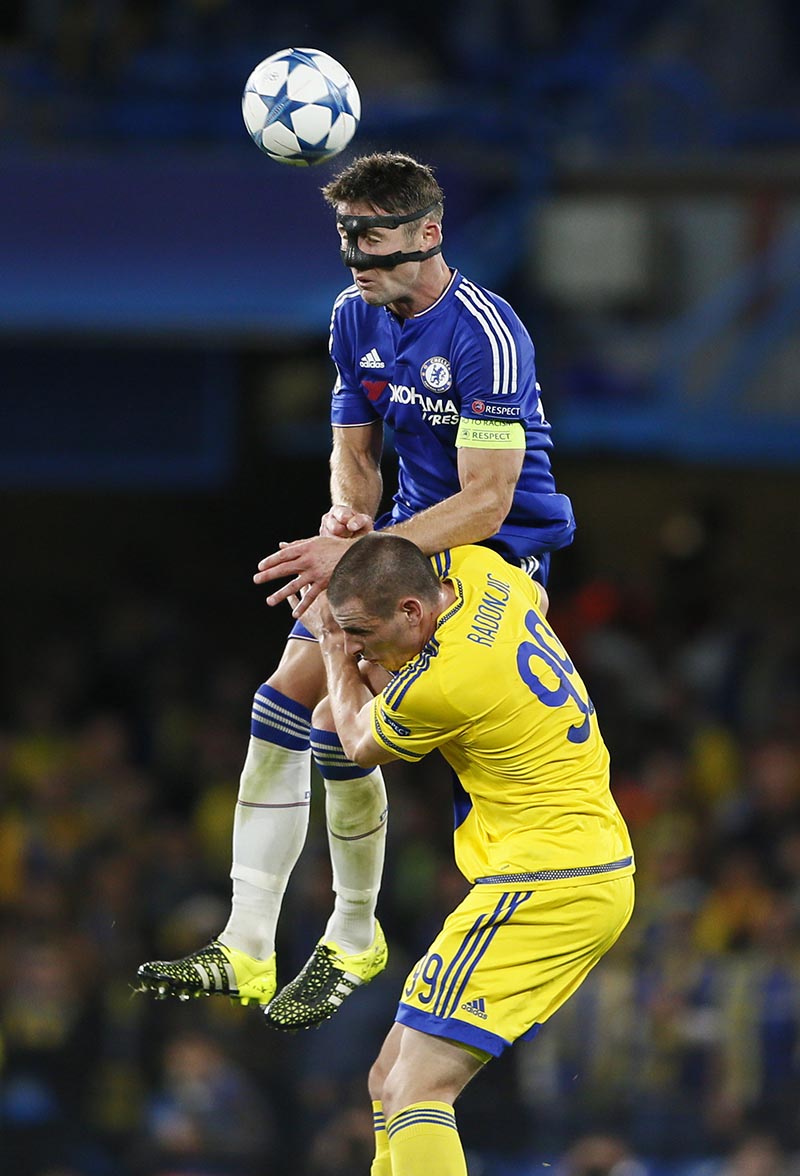 Chelsea's Gary Cahill in action with Tel Aviv's Dejan Radonjic. Photo: Reuters