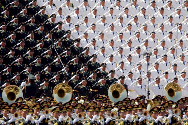 Military band sing and salute at the Tiananmen Square at the beginning of the military parade marking the 70th anniversary of the end of World War Two, in Beijing, China, September 3, 2015.nPhoto: Reutersn
