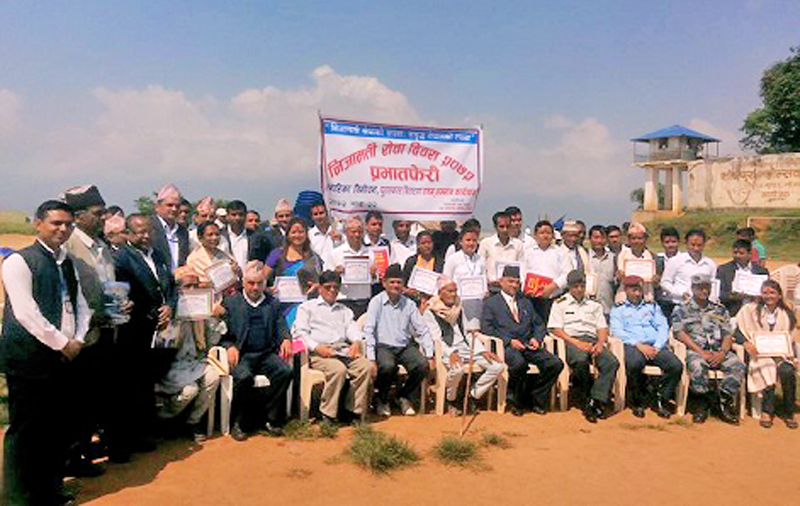 Workers posing for a group photo after a gathering programme organised on the occasion of Civil Service Day, in Bhojpur, on Tuesday, September 8, 2015. Photo: Niroj Koirala