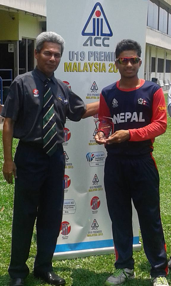 Nepal's Sushil Kandel receives the man-of-the-match trophy after their victory over Saudi Arabia in the ACC U-19 premier match in Kuala Lumpur on Thursday.