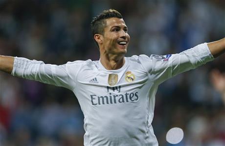 Real Madrid's Cristiano Ronaldo celebrates after scoring after an hat trick during a Group A Champions League soccer match between Real Madrid and Shakhtar Donetsk at the Santiago Bernabeu stadium in Madrid, Spain, Tuesday, Sept. 15, 2015. AP