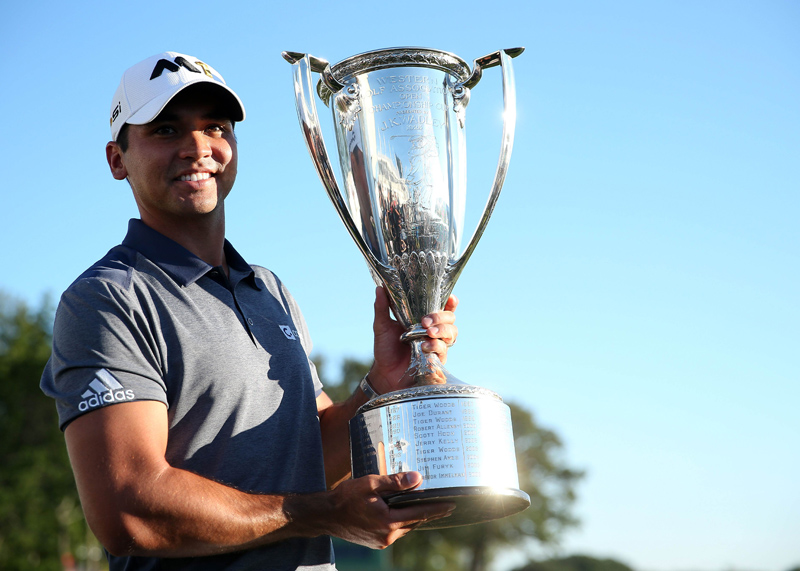 Jason Day of Australia holds the trophy after winning the BMW Championship at the Conway Farms Golf Club in Illinois on Sunday. Photo: AFP