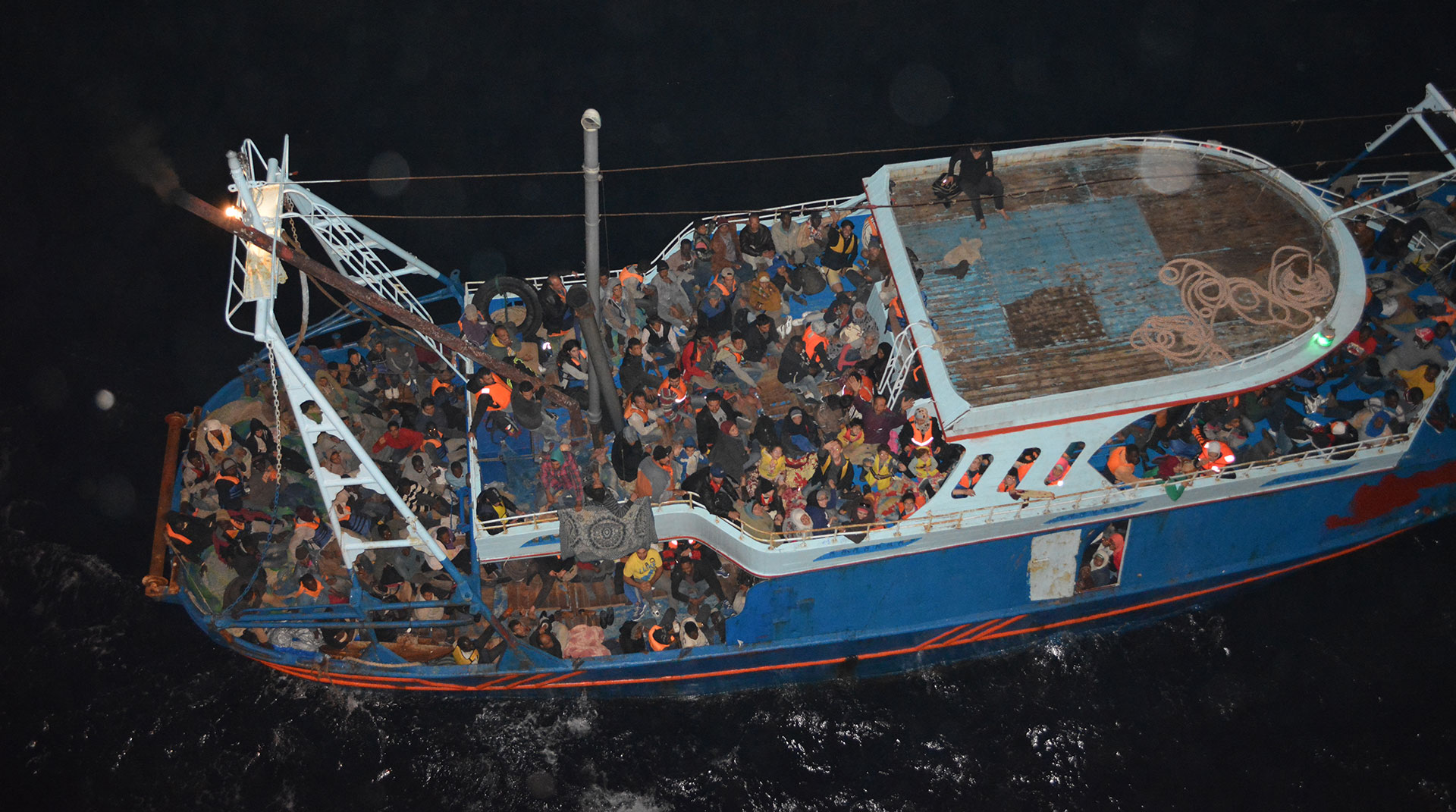 A fishing boat carrying migrants in the Mediterranean is seen from the commercial ship CS Caprice in this handout photograph taken October 22, 2014 and provided to Reuters, September 14, 2015.