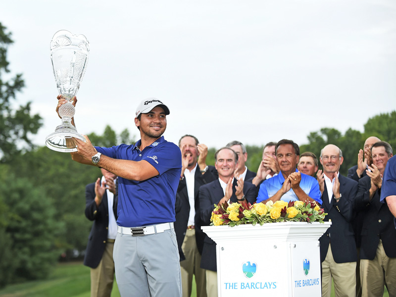 Jason Day of Australia celebrates with the trophy after winng The Barclays Championship at the Plainfield Country Club in Edison on Sunday. Photo: Reuters