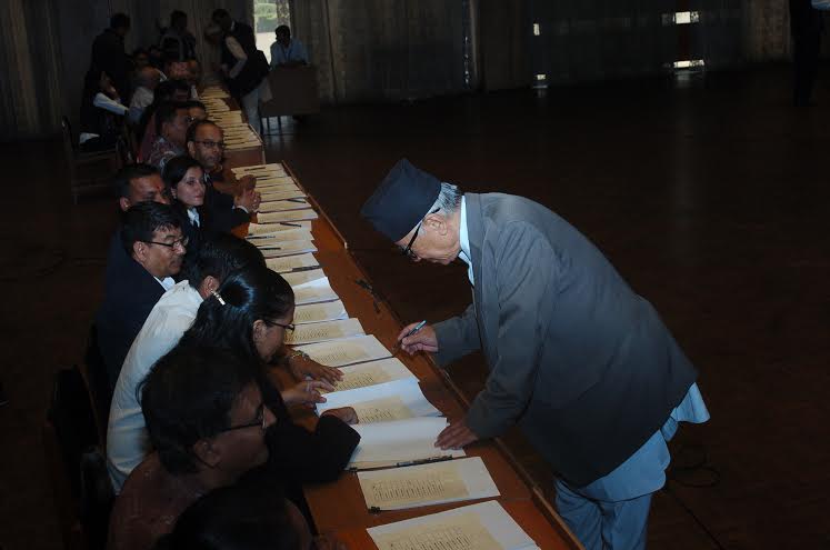 A Constituent Assembly member signing on the amended bill of the new constitution at Lhotse Hall of the CA Building in New Baneshwor on Friday, September 18, 2015. Photo: Dhruba Ale 