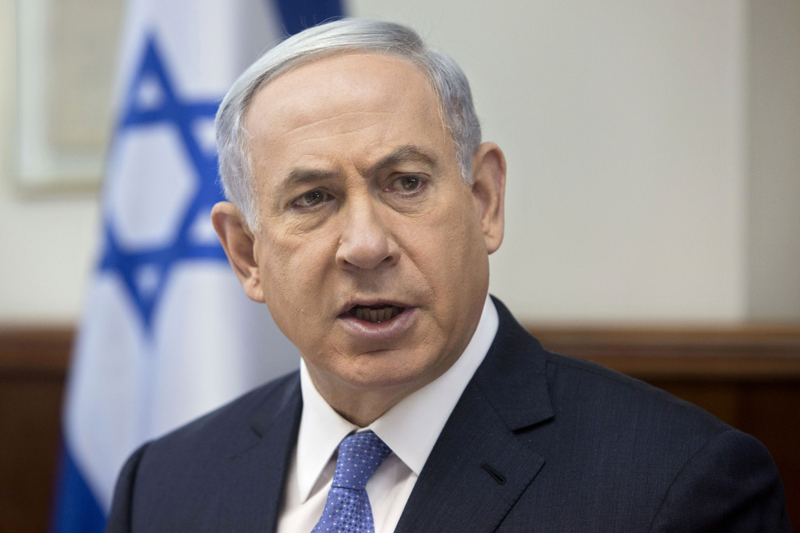 FILE -  In this Sunday, June 7, 2015, file photo, Israeli Prime Minister Benjamin Netanyahu attends the weekly cabinet meeting in his Jerusalem office. Israel's prime minister will convene an u0093emergency meetingu0094 over recent Palestinian attacks, an official at his office said Monday hours after a man died from wounds sustained when rocks were thrown at his car and violence broke out at Jerusalem's most sensitive holy site for a second day in a row. Photo: AP