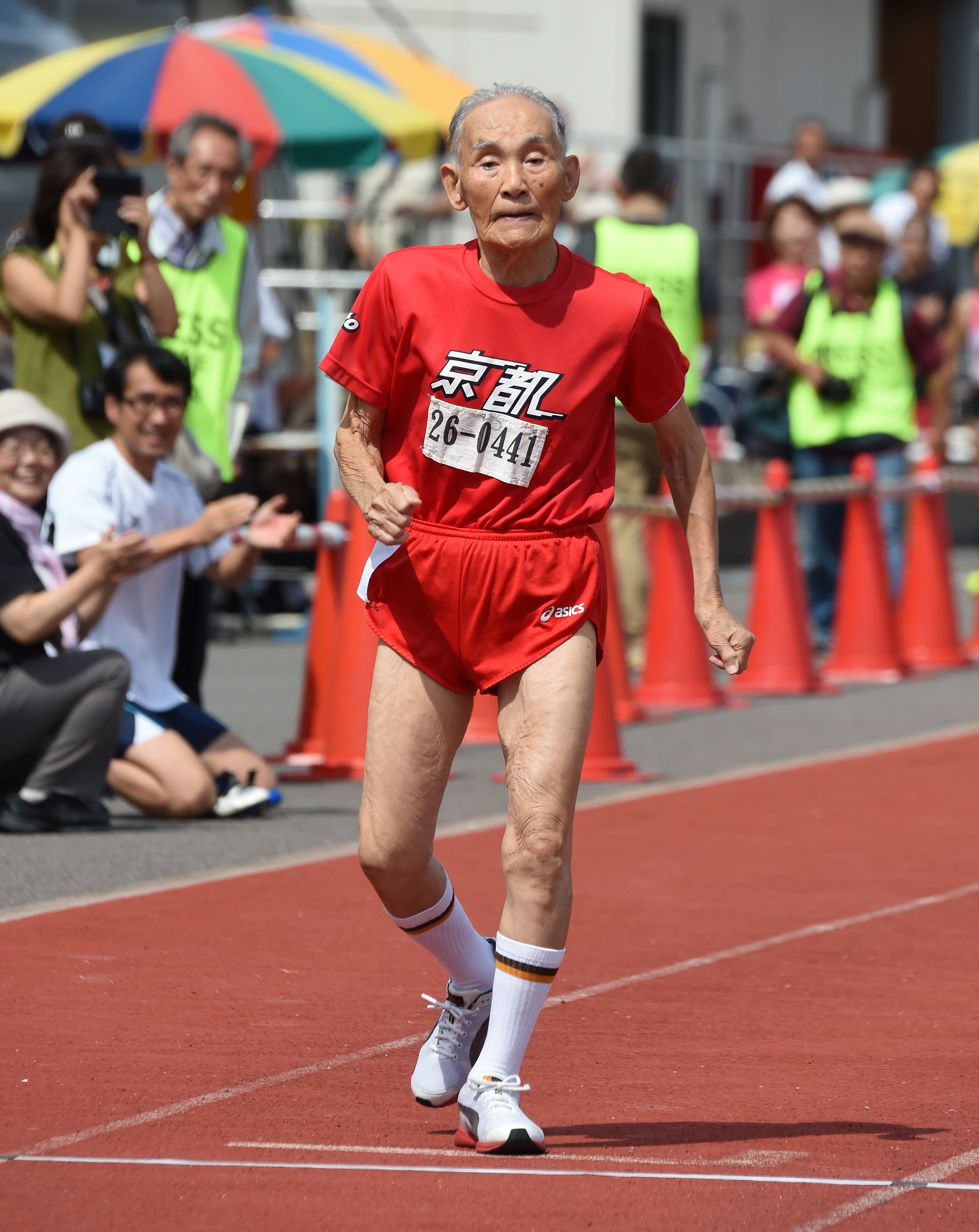 Hidekichi Miyazaki, 105, crosses the finishing line after running with other competitors over eighty years of age during a 100-metre-dash in the Kyoto Masters Autumn Competiton in Kyoto, western Japan, on September 23, 2015. Miyazaki was authorised as the oldest sprinter who competed in a 100-metre-dash by the Guinness World Records.      AFP PHOTO / Toru YAMANAKA