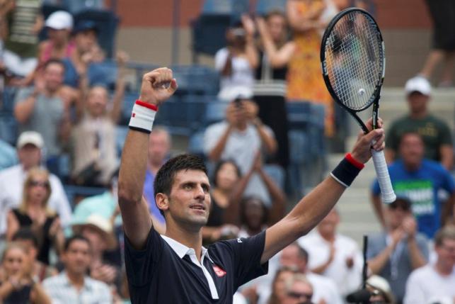 Novak Djokovic of Serbia celebrates after defeating Andreas Seppi of Italy in their third round match at the U.S. Open Championships tennis tournament in New York, September 4, 2015.  REUTERS/Adrees Latif