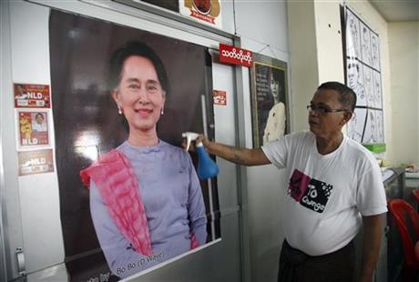 A supporter cleans a portrait of Myanmar opposition leader Aung San Suu Kyi at her National League for Democracy party headquarters in Yangon, Myanmar, Tuesday, Sept. 8, 2015. On Tuesday, the opposition leader kicked off campaigning for Myanmar's historic Nov. 8 general election with a Facebook post u2014 one of many signs of how far the country and its most recognizable politician have come in a few years. Photo: Ap