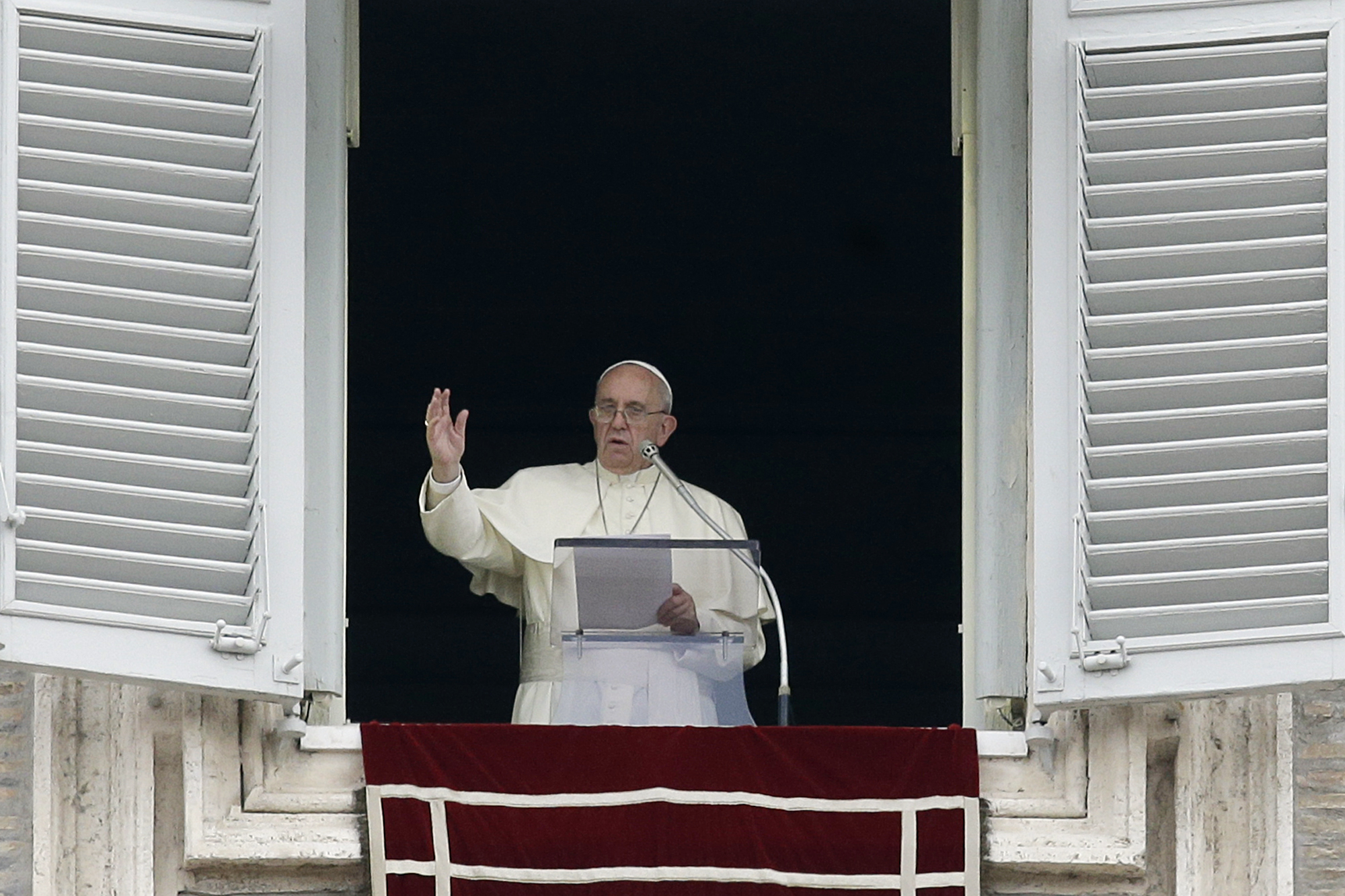 Pope Francis delivers a blessing from his studio's window overlooking St. Peter's Square on the occasion of the Angelus noon prayer at the Vatican, Sunday, Sept. 13, 2015. Photo: AP