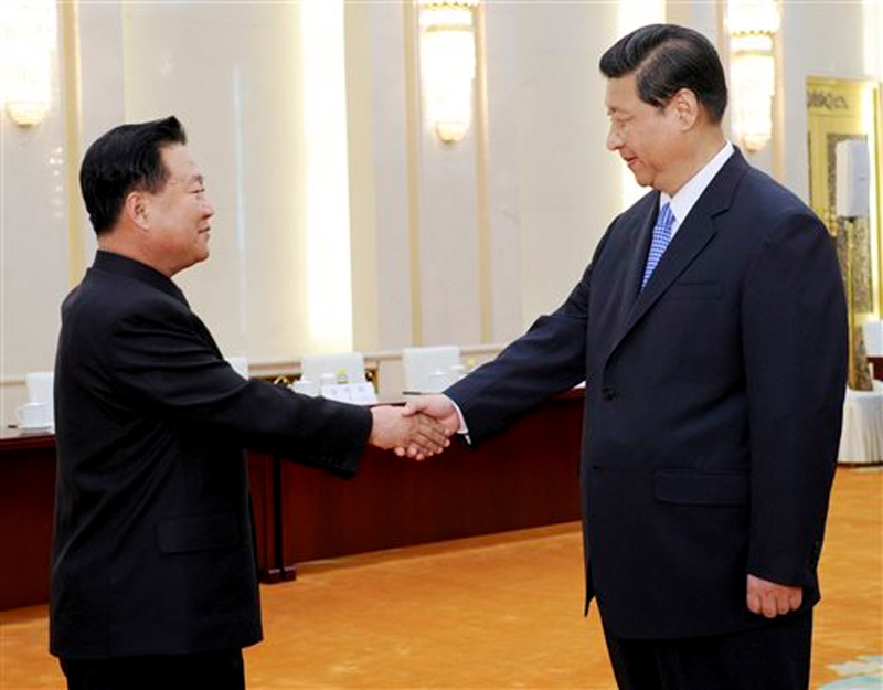 North Korean Vice Marshal Choe Ryong Hae, left, is greeted by Chinese President Xi Jinping on  May 24, 2013. Photo: AP