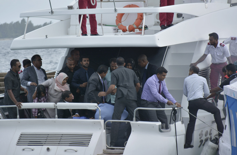 Unidentified injured people are evacuated after a blast on the Maldives President Yameen Abdul Gayoom speedboat in Male, Maldives Monday, Sept. 28, 2015. Gayoom's wife Fathimath Ibrahim and several officials suffered minor injuries. The country's international airport is on a separate island and a short boat trip is needed to reach the capital island. (Yoosuf Sofwan/Sun Online via AP) NO ARCHIVE, NO SALES