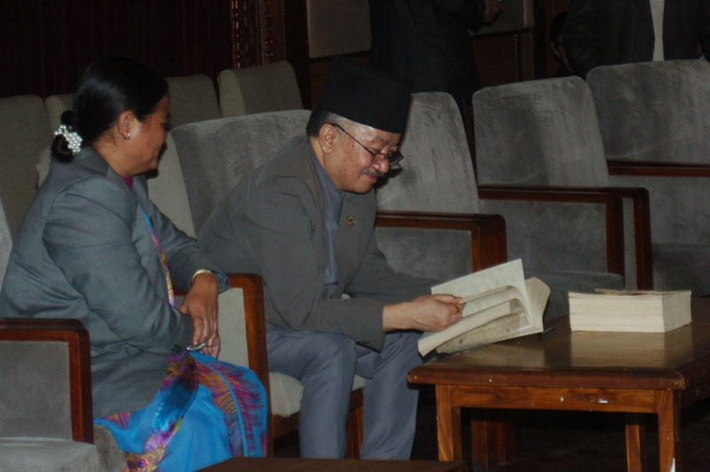 CA Chairman Subas Chandra Nembang (right) and Vice-Chairman Onsari Gharti read the new constitution, in New Baneshwor of Kathmandu, on Friday, September 18, 2015. Photo: Dhruba Ale