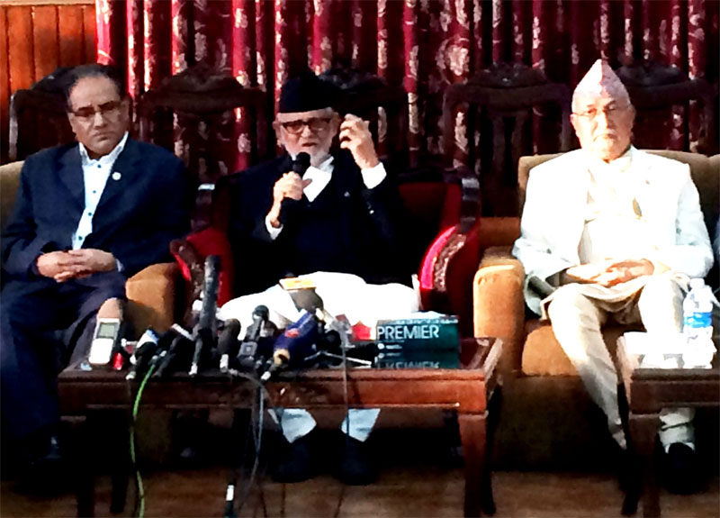 Flanked by UCPN-Maoist Chairman Pushpa Kamal Dahal (left) and CPN-UML Chairman KP Sharma Oli, Prime Minister Sushil Koirala speaks at a press meet organised at his residence in Baluwatar, on Saturday, September 19, 2015. Photo: PM's Secretariat