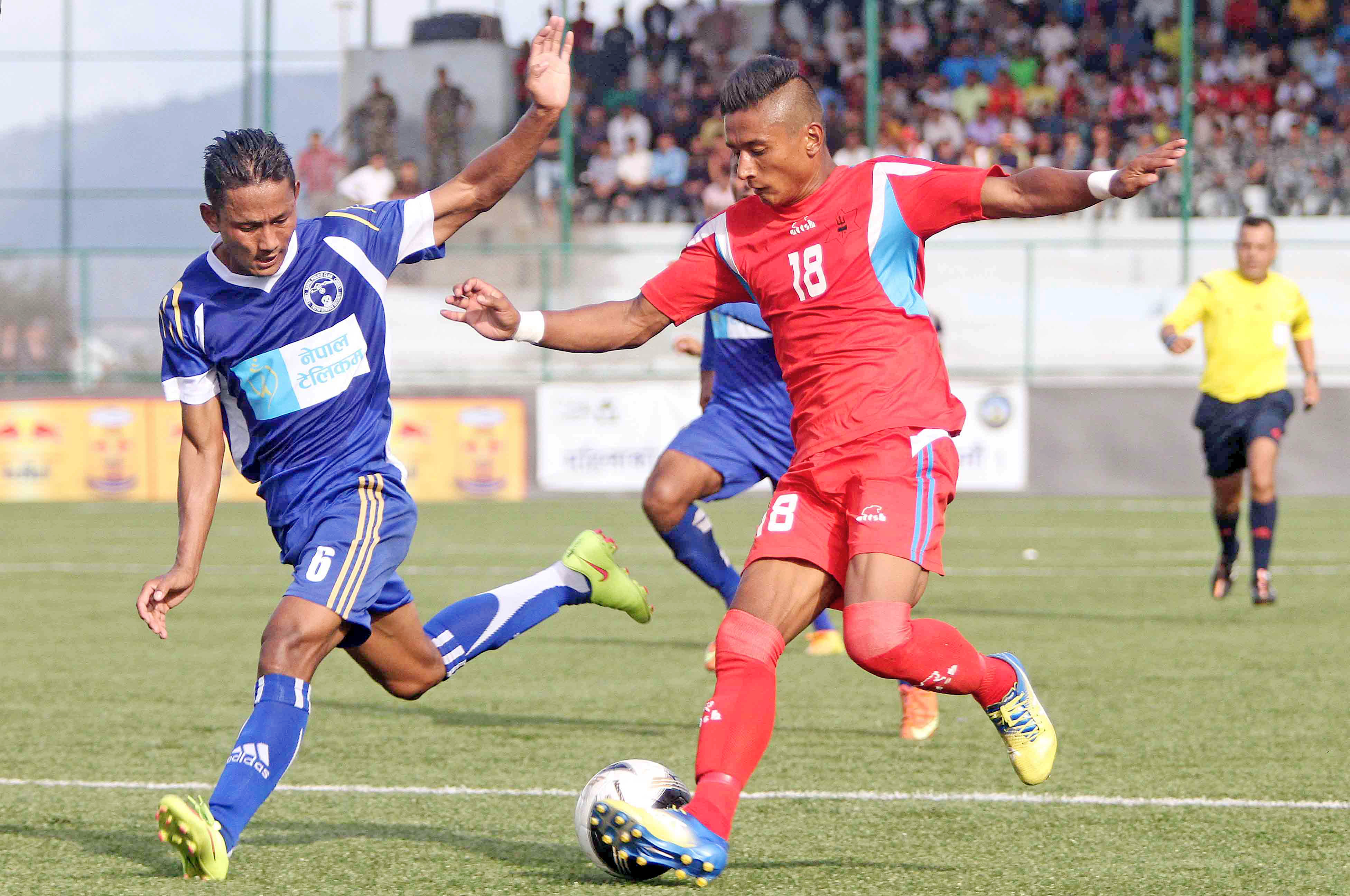 Nabayug Shrestha (right) of Tribhuvan Army Club vies for the ball against Bikram Dhimal of Nepal Police Club during their Red Bull National League match at ANFA Complex in Lalitpur on Thursday. (Credit Image: Udipt Singh Chhetry)