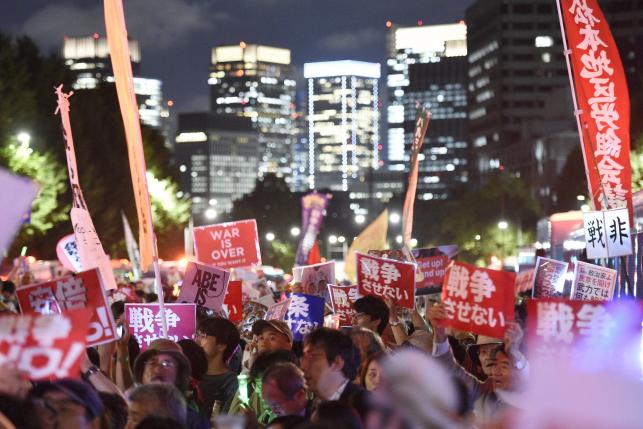 Protesters gather at a rally against Japan's Prime Minister Shinzo Abe's security bill and his administration in front of the parliament building in Tokyo, in this photo taken by Kyodo September 14, 2015. Photo: REUTERS