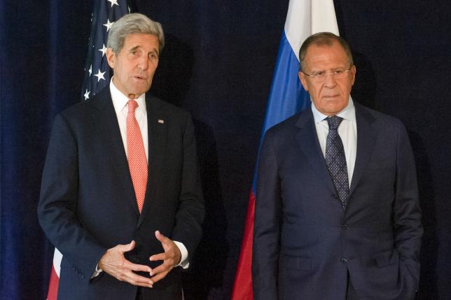US Secretary of State John Kerry (L) poses with Russian Foreign Minister Sergei Lavrov during their meeting ahead of the United Nations General Assembly in New York September 27, 2015. Photo: REUTERS