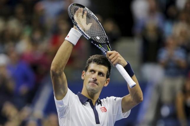 Serbia's Novak Djokovic celebrates victory over Spain's Roberto Bautista Agut in their fourth round match at the U.S. Open Championships tennis tournament in New York, September 6, 2015. Photo: REUTERS