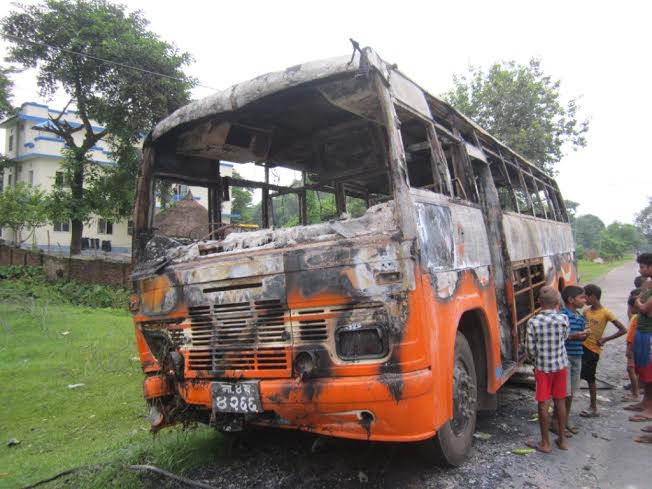 A bus torched by the cadres of United Democratic Front in Saptari on Thursday, September 3, 2015. Photo: 
